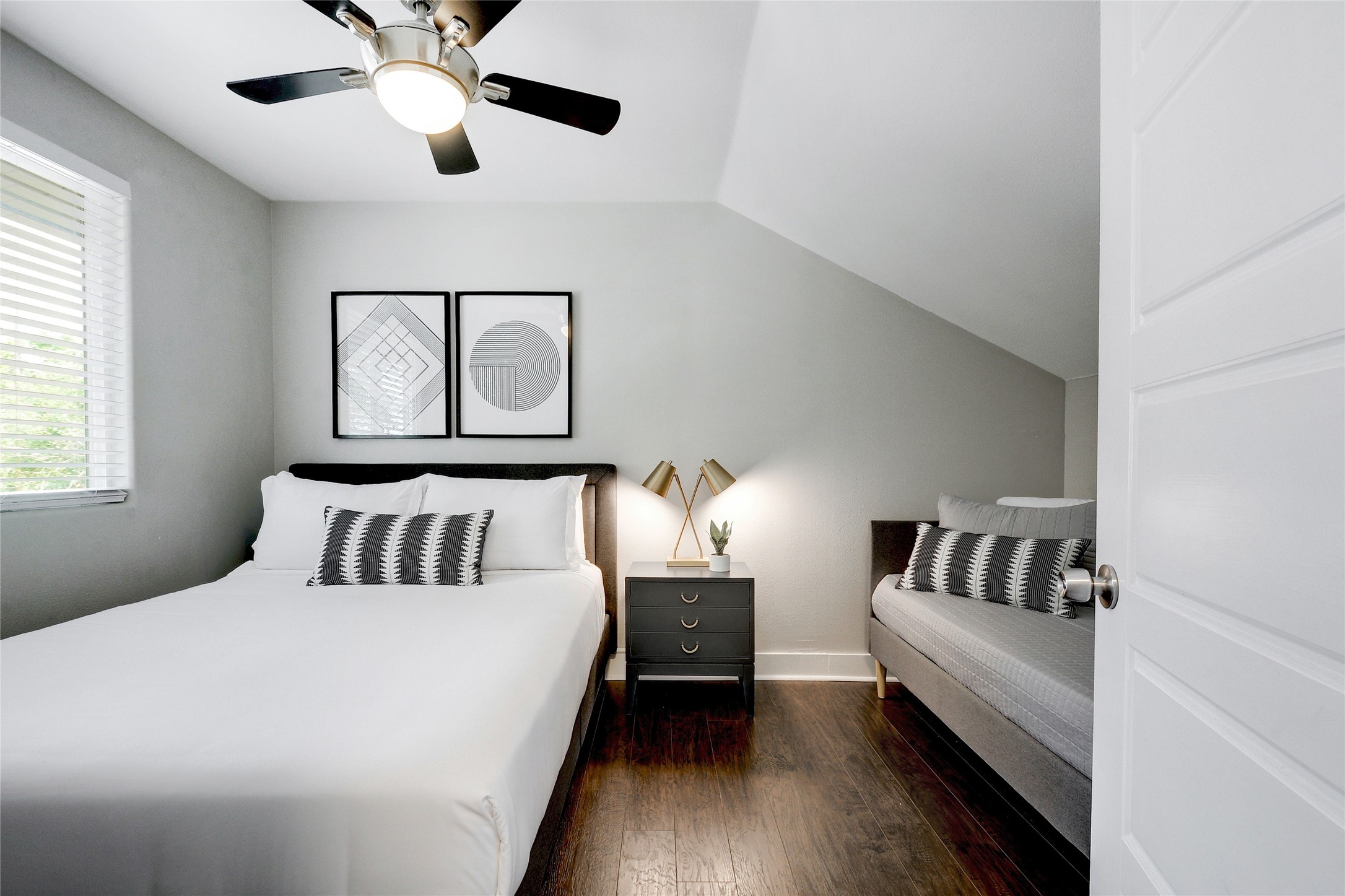 Undisclosed Address Austin, TX 78721 - Photo 29 of 35 Bedroom featuring dark wood-style floors, vaulted ceiling, and ceiling fan