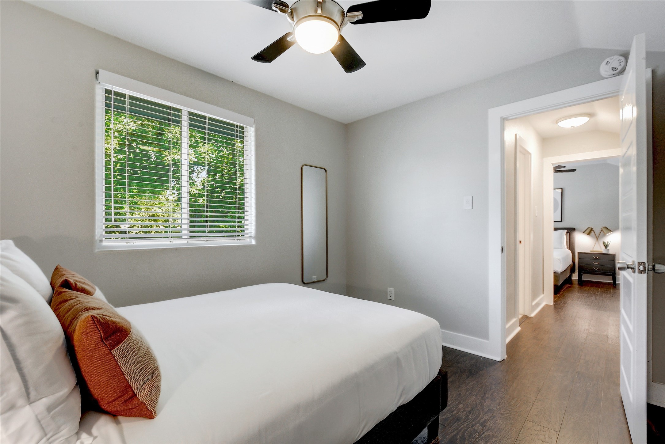 Undisclosed Address Austin, TX 78721 - Photo 29 of 36 a bedroom with a bed and a large mirror