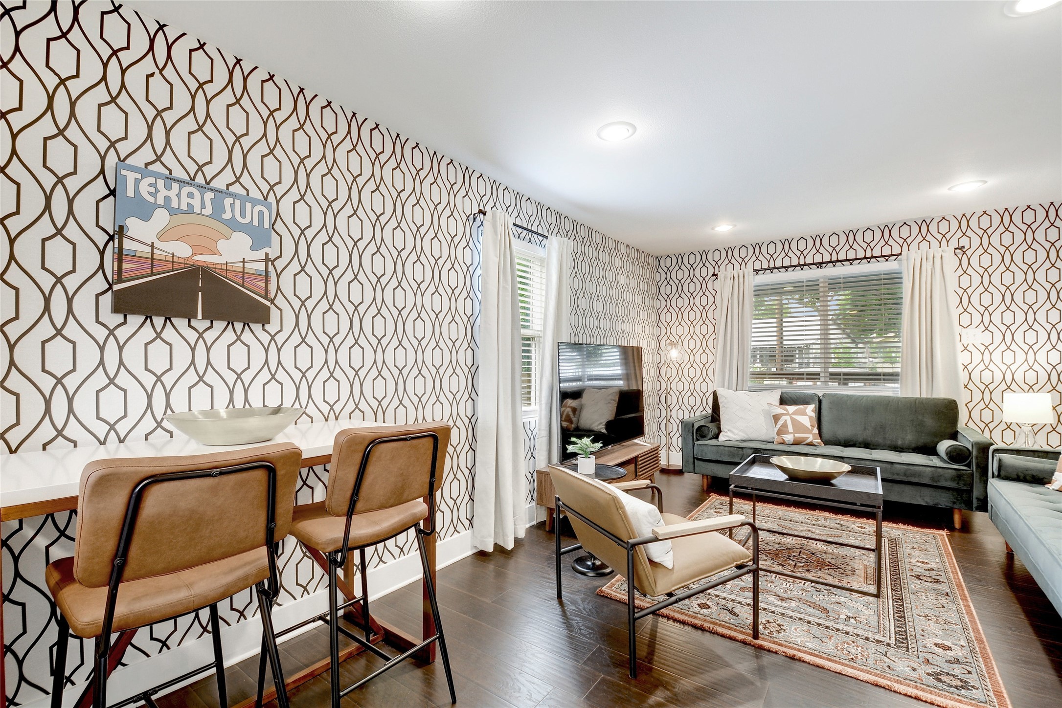 Undisclosed Address Austin, TX 78721 - Photo 5 of 35 Living area featuring wallpapered walls, dark wood finished floors, plenty of natural light, and recessed lighting
