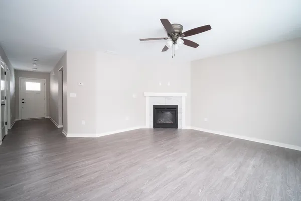 a view of a kitchen with wooden floor and a kitchen