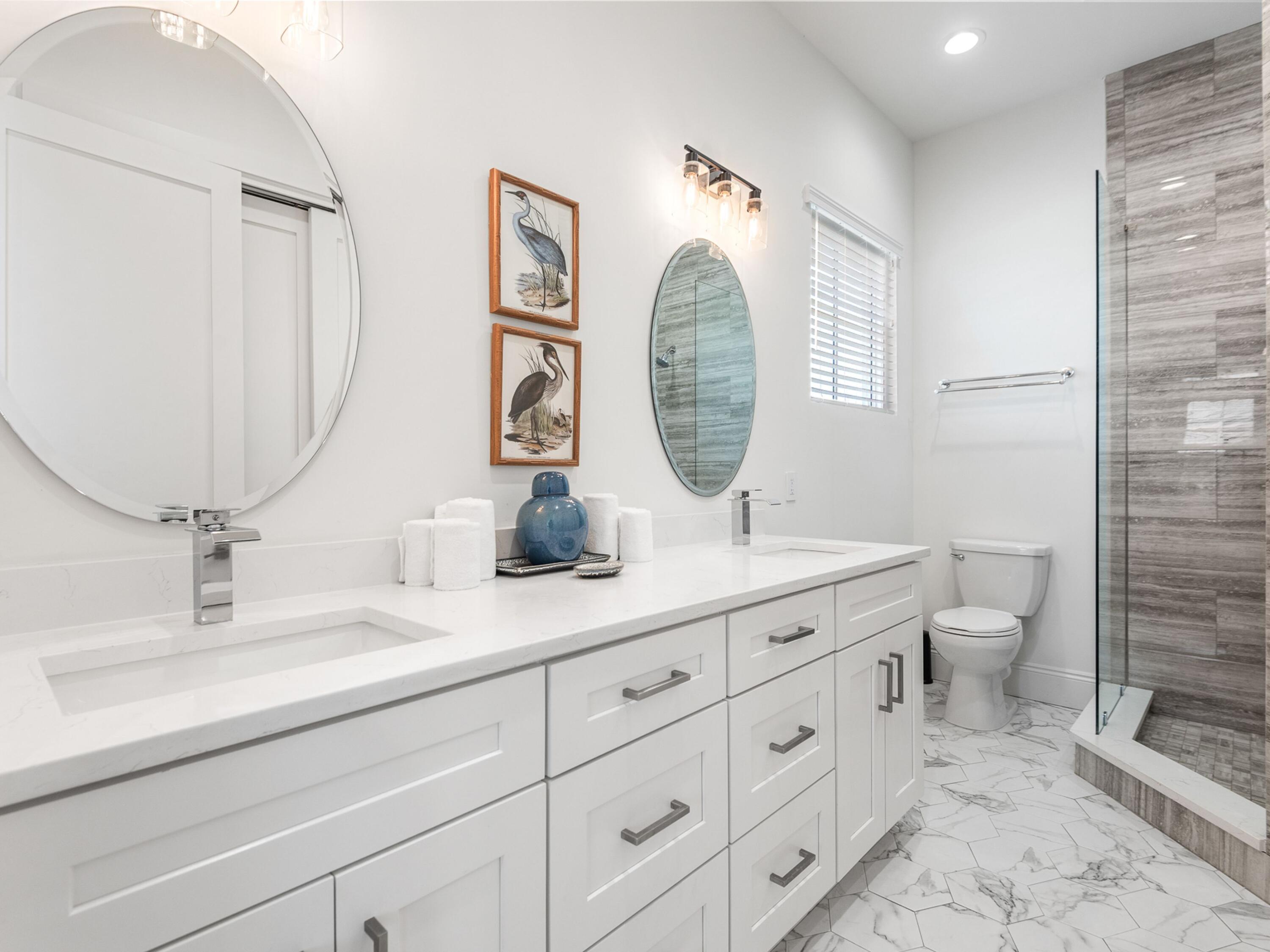 50 Camelot Lane Santa Rosa Beach, FL 32459 - Photo 20 of 39 a bathroom with a toilet a sink and mirror