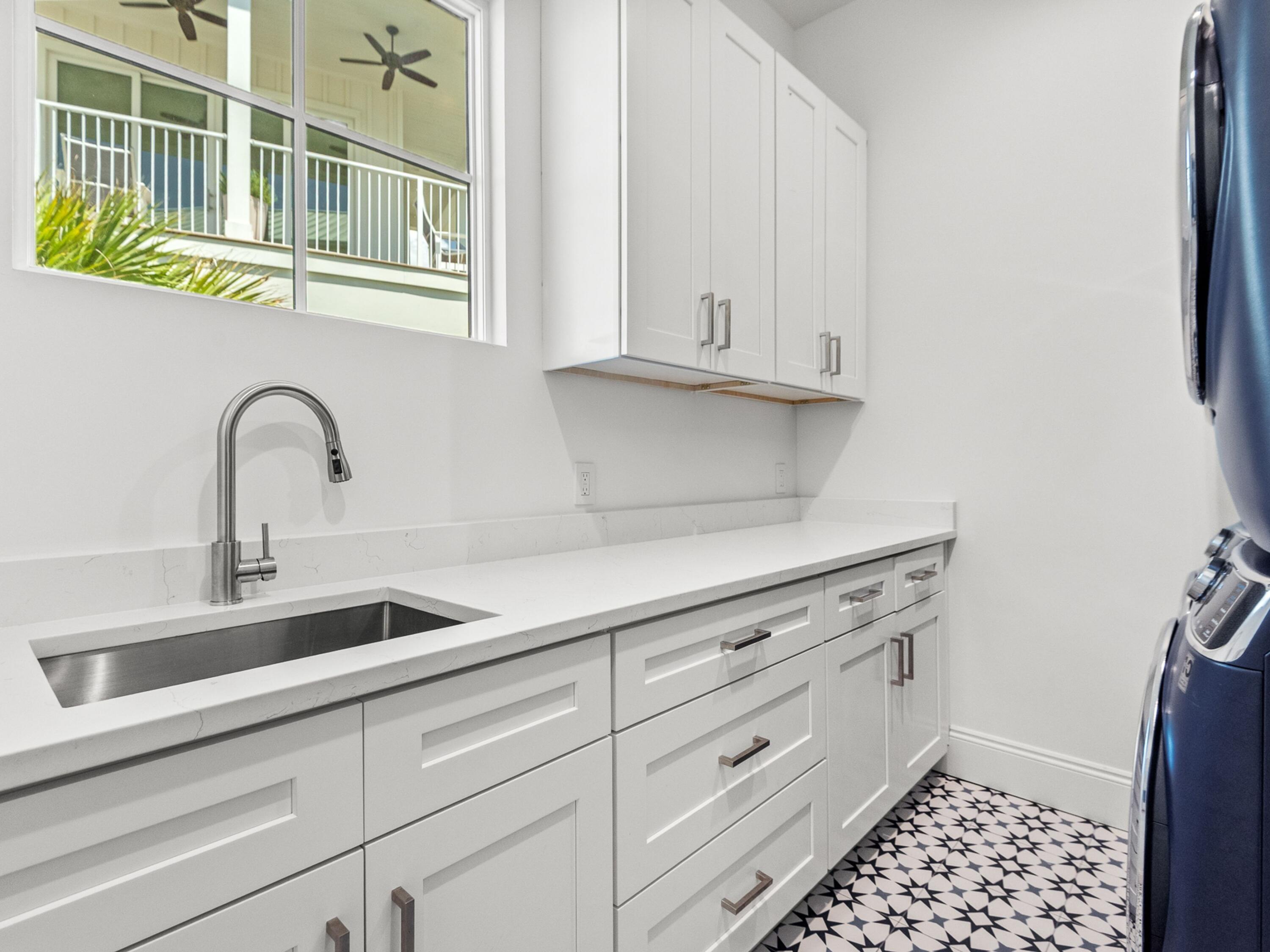 50 Camelot Lane Santa Rosa Beach, FL 32459 - Photo 30 of 39 a kitchen with stainless steel appliances a sink and cabinets