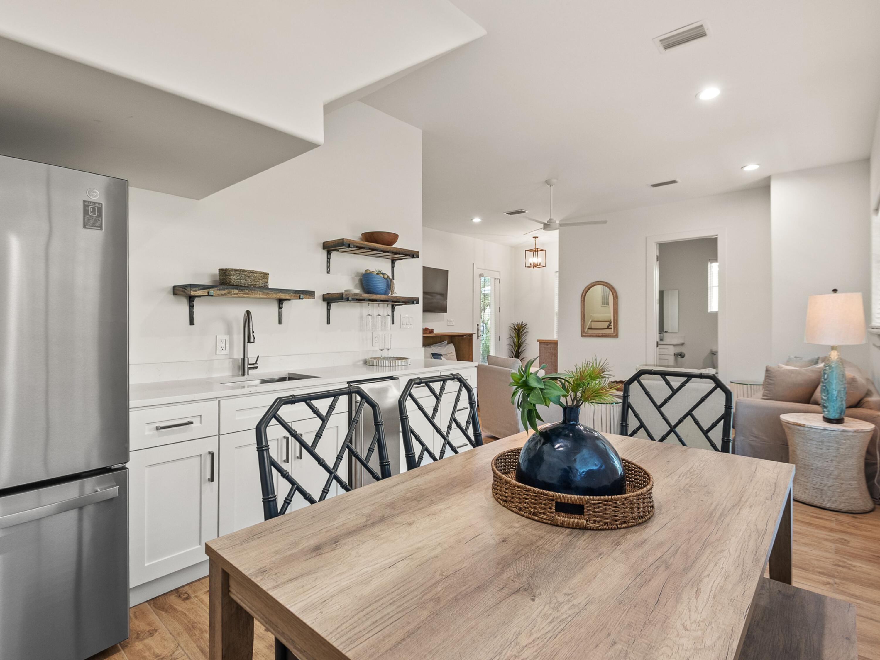 50 Camelot Lane Santa Rosa Beach, FL 32459 - Photo 34 of 39 a kitchen with a table and chairs