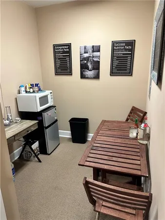 a view of a workspace with furniture