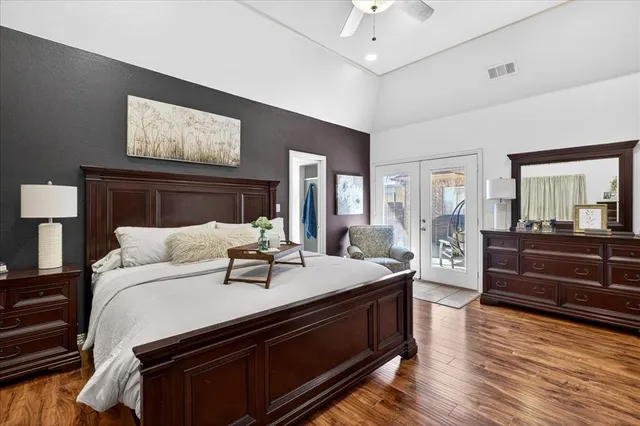 a bed room with a bed and a dresser