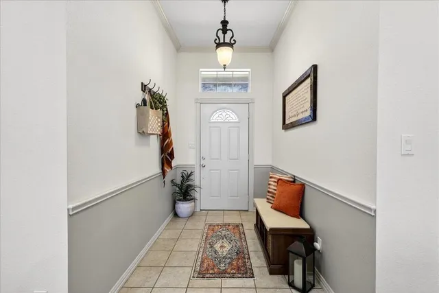 a view of hallway with furniture and wooden floor