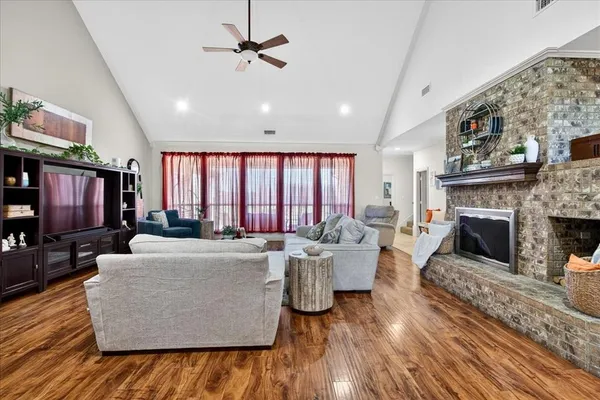 a living room with furniture and a fireplace