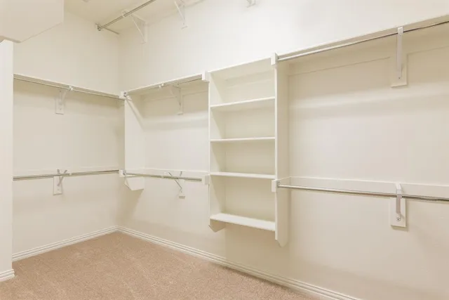a view of an empty walk in closet