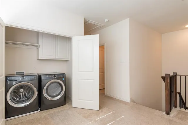 a view of storage and utility room with washer and dryer
