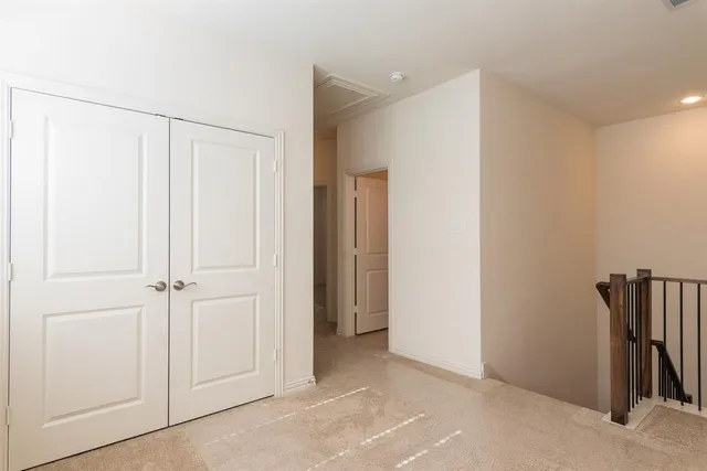 a view of a hallway with closet area