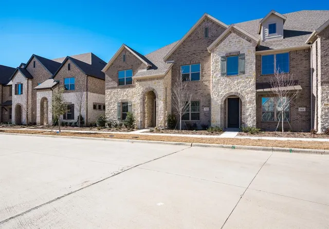 a view of a white house with a outdoor space
