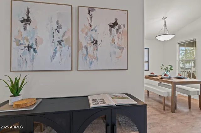 a view of a workspace with furniture and window