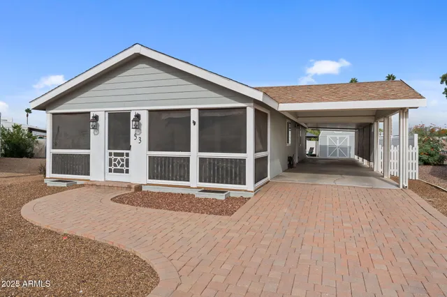 a view of a house with wooden floor and a window