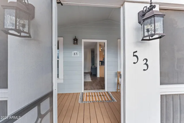 a view of a hallway view with wooden floor and staircase