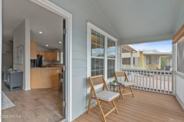 a view of a livingroom with furniture and windows