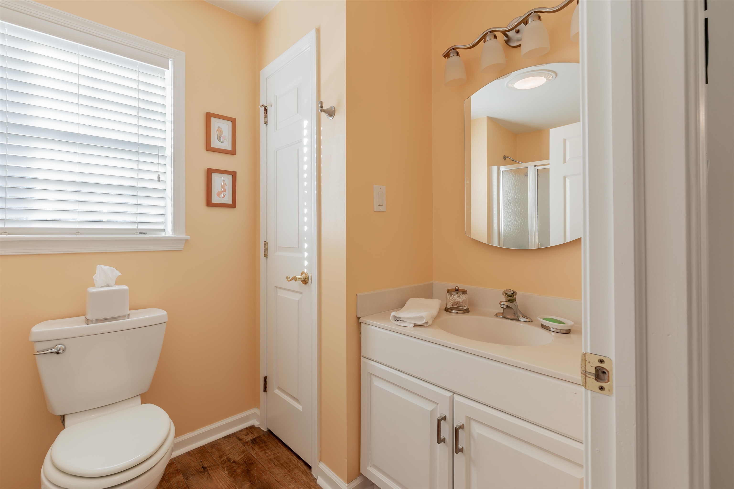 10 Adelphia Road Cape May, NJ 08204 - Photo 36 of 46 a bathroom with a toilet sink and mirror