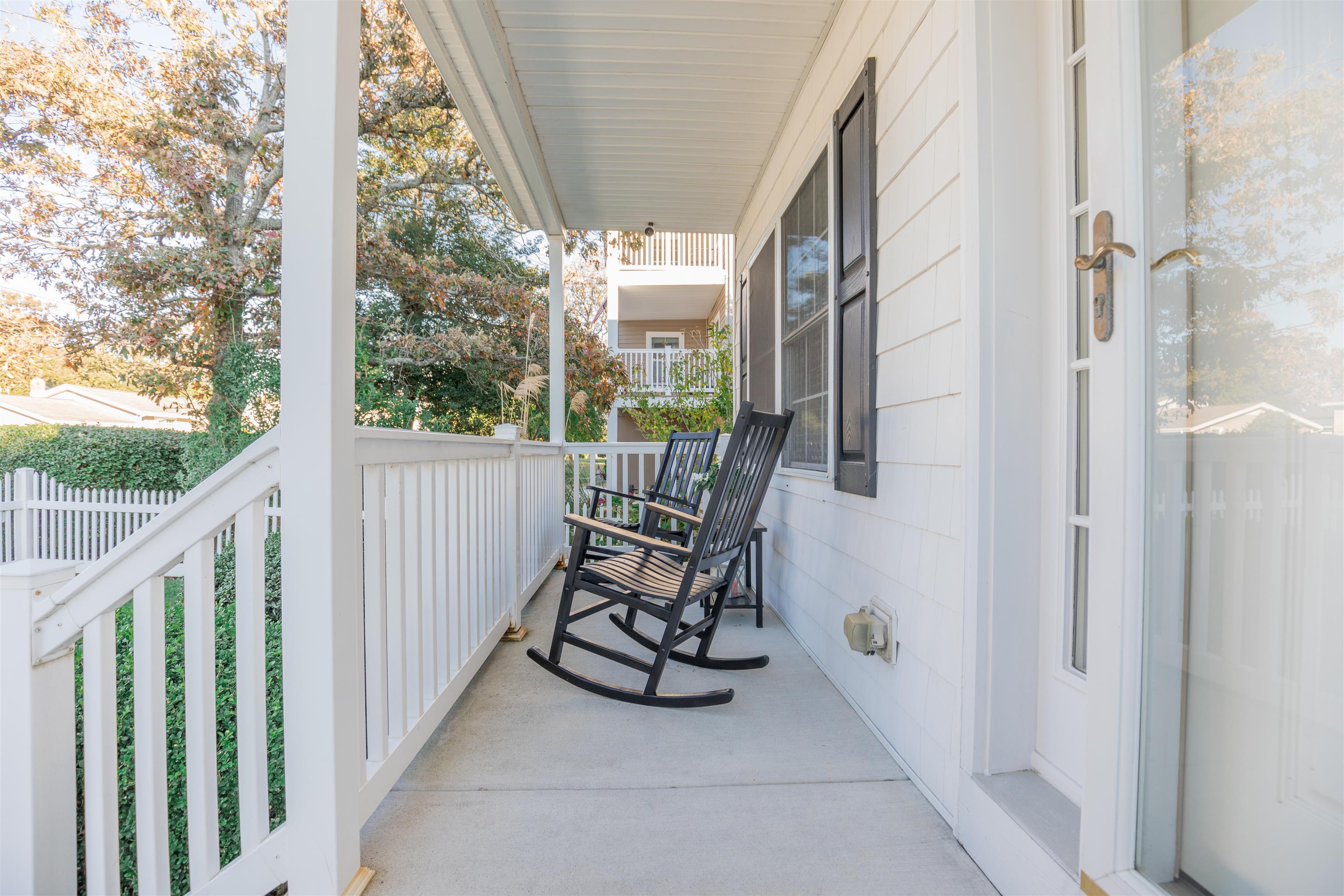 10 Adelphia Road Cape May, NJ 08204 - Photo 42 of 46 a view of a balcony with wooden floor and chair
