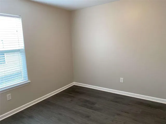 a view of a yard with trees