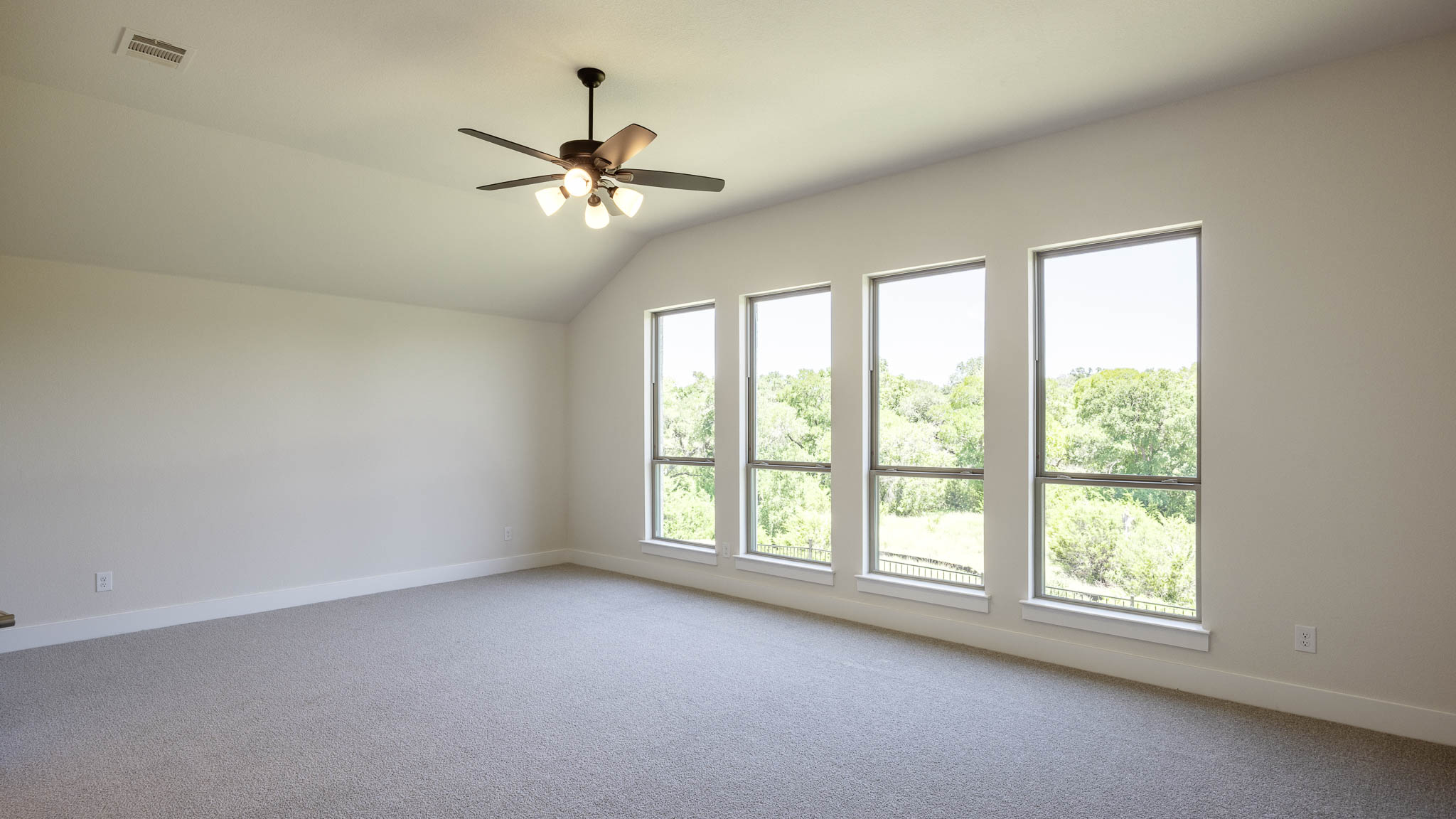 208 Meadow Beauty Lane Georgetown, TX 78633 - Photo 9 of 16 Bonus room featuring light colored carpet, lofted ceiling, and ceiling fan
