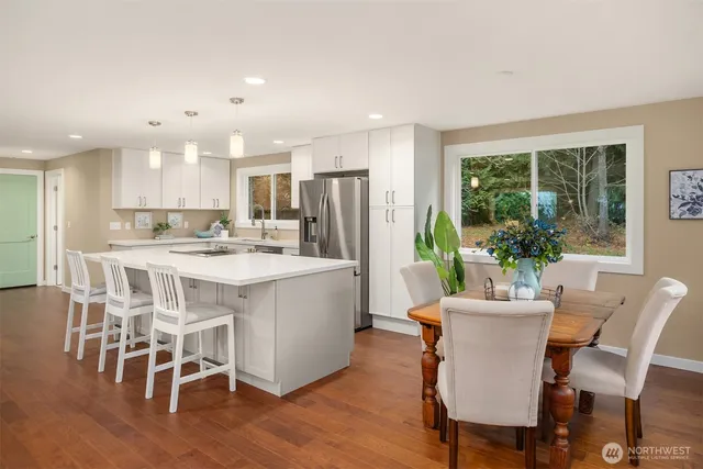 a view of a dining room with furniture window and wooden floor