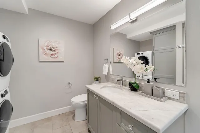 a bedroom with a bed and a chair