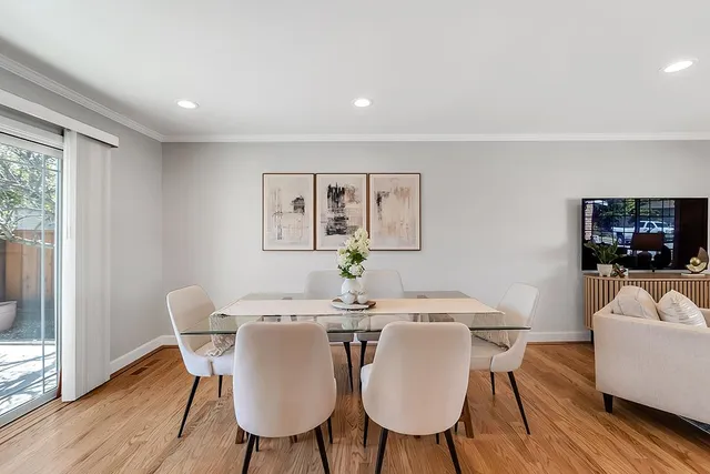 a view of a dining room with furniture window and wooden floor