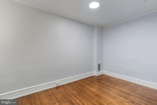 a view of a brick building with many windows