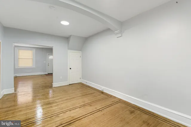 a kitchen with granite countertop a refrigerator and a sink