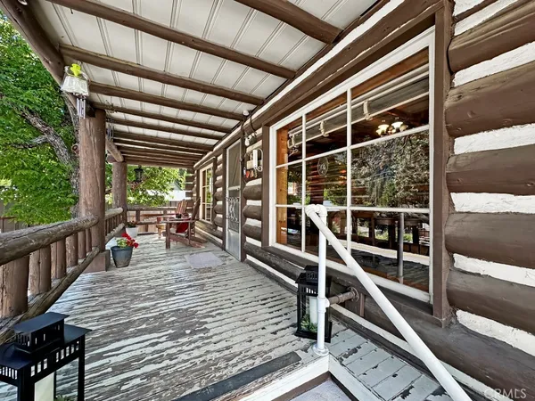 a view of a balcony with chairs
