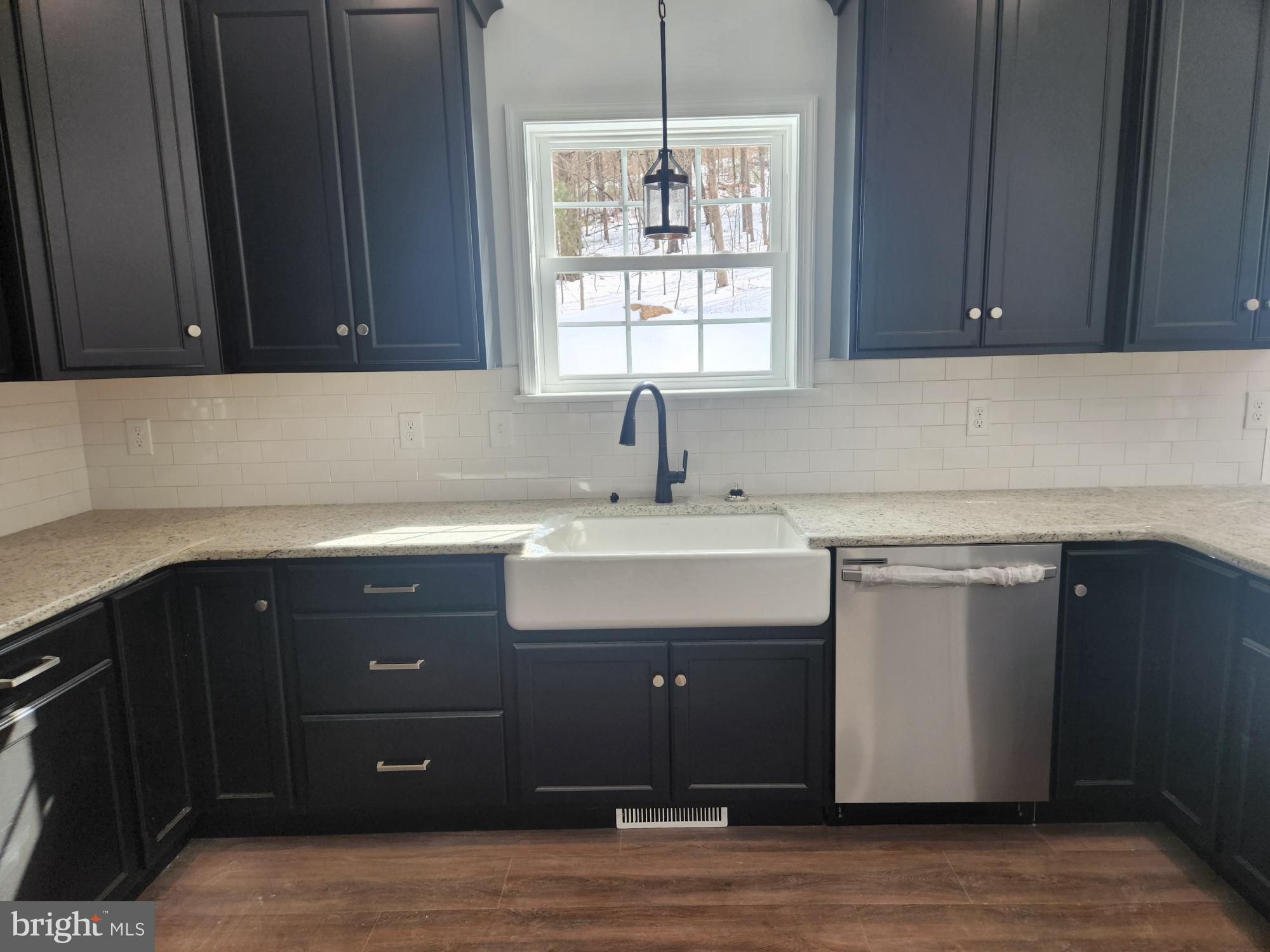 1929 Dunkleberger Road Elliottsburg, PA 17024 - Photo 5 of 48 Modern kitchen with sleek black cabinetry.