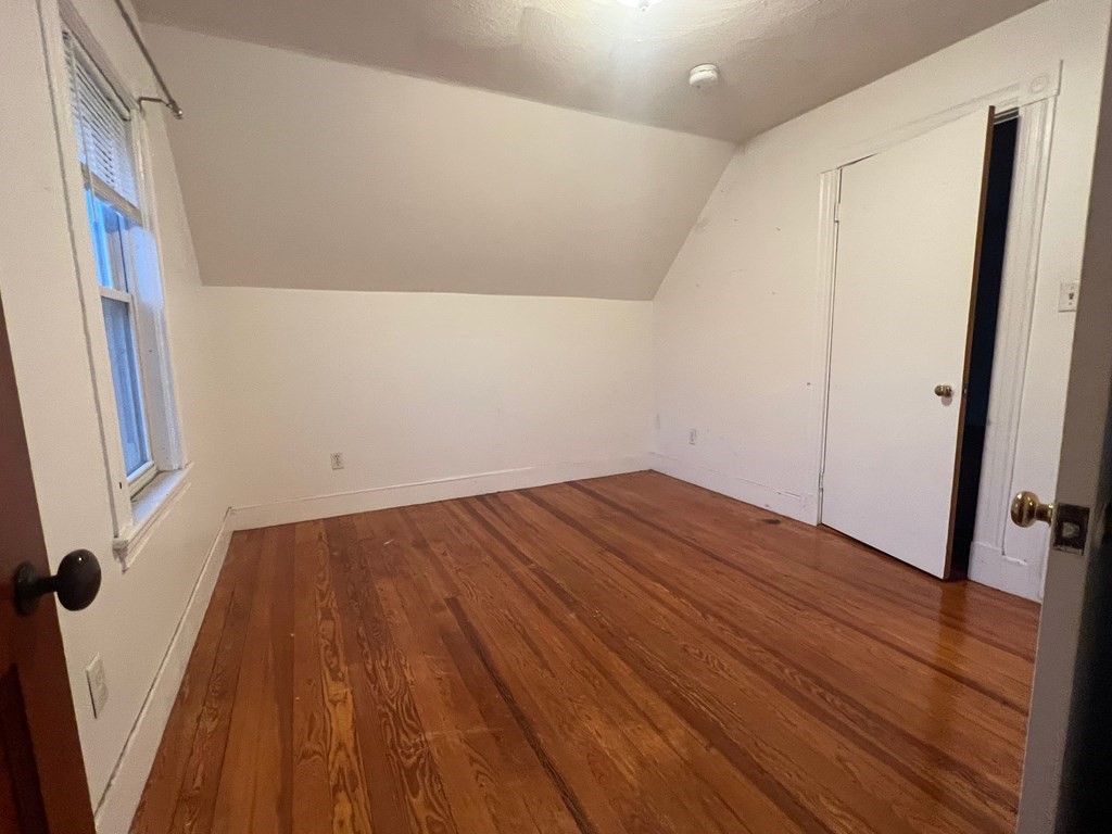 178 Larch Road Cambridge, MA 02138 - Photo 12 of 15 a view of empty room with wooden floor