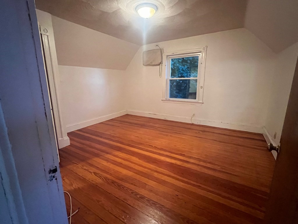 178 Larch Road Cambridge, MA 02138 - Photo 15 of 15 a view of empty room with wooden floor and fan