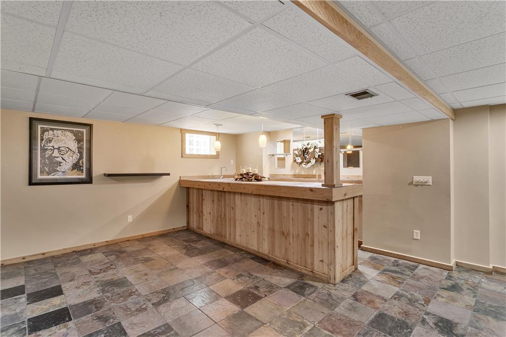 131 Oak Street Spring Church, PA 15686 - Photo 14 of 16 a large white kitchen with a wooden floor and a sink