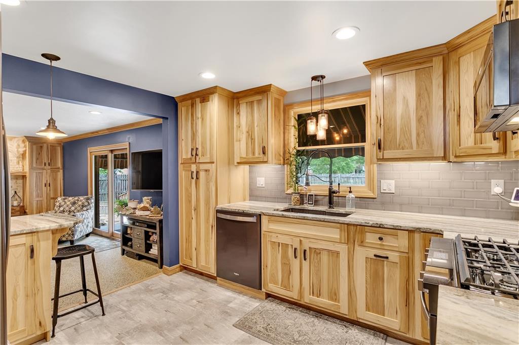 131 Oak Street Spring Church, PA 15686 - Photo 8 of 16 a kitchen with stainless steel appliances granite countertop a sink and cabinets