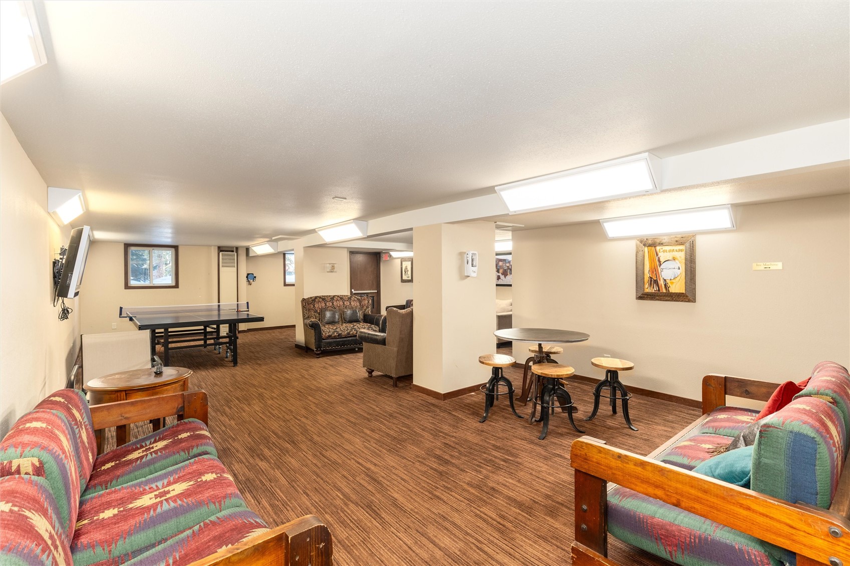 110 Sawmill Road, Unit 4B Breckenridge, CO 80424 - Photo 23 of 28 The three story lodge offers TVs, games, ping pong, foosball, billiards, a library, a laundry room, hot tubs, and an outdoor bbq area.