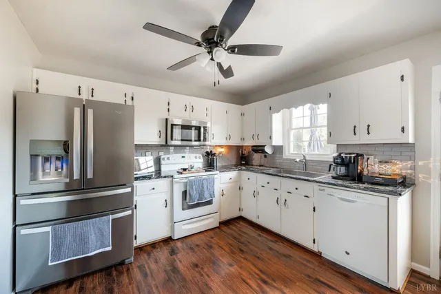 a kitchen with a stove and a window