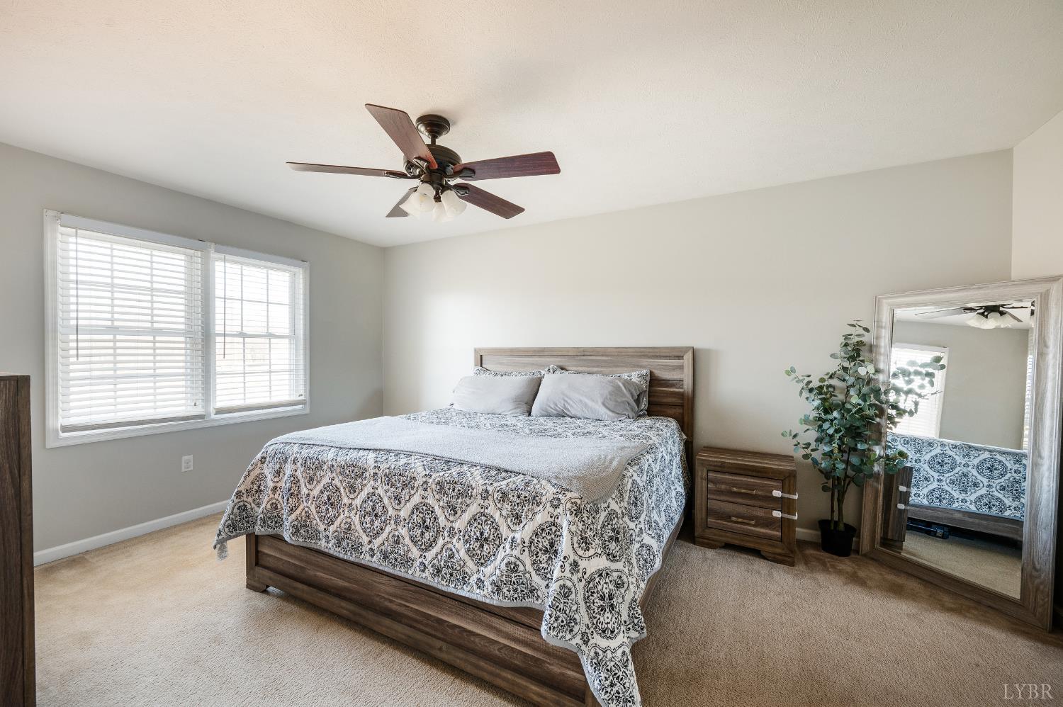 746 Church Street Appomattox, VA 24522 - Photo 14 of 36 a bedroom with a bed and a couch