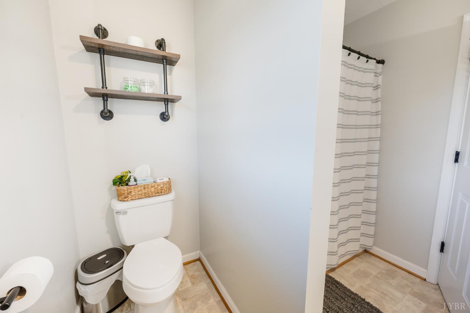 746 Church Street Appomattox, VA 24522 - Photo 17 of 36 a white toilet sitting next to a shower