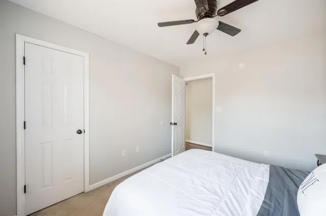 a bathroom with a sink toilet mirror and vanity