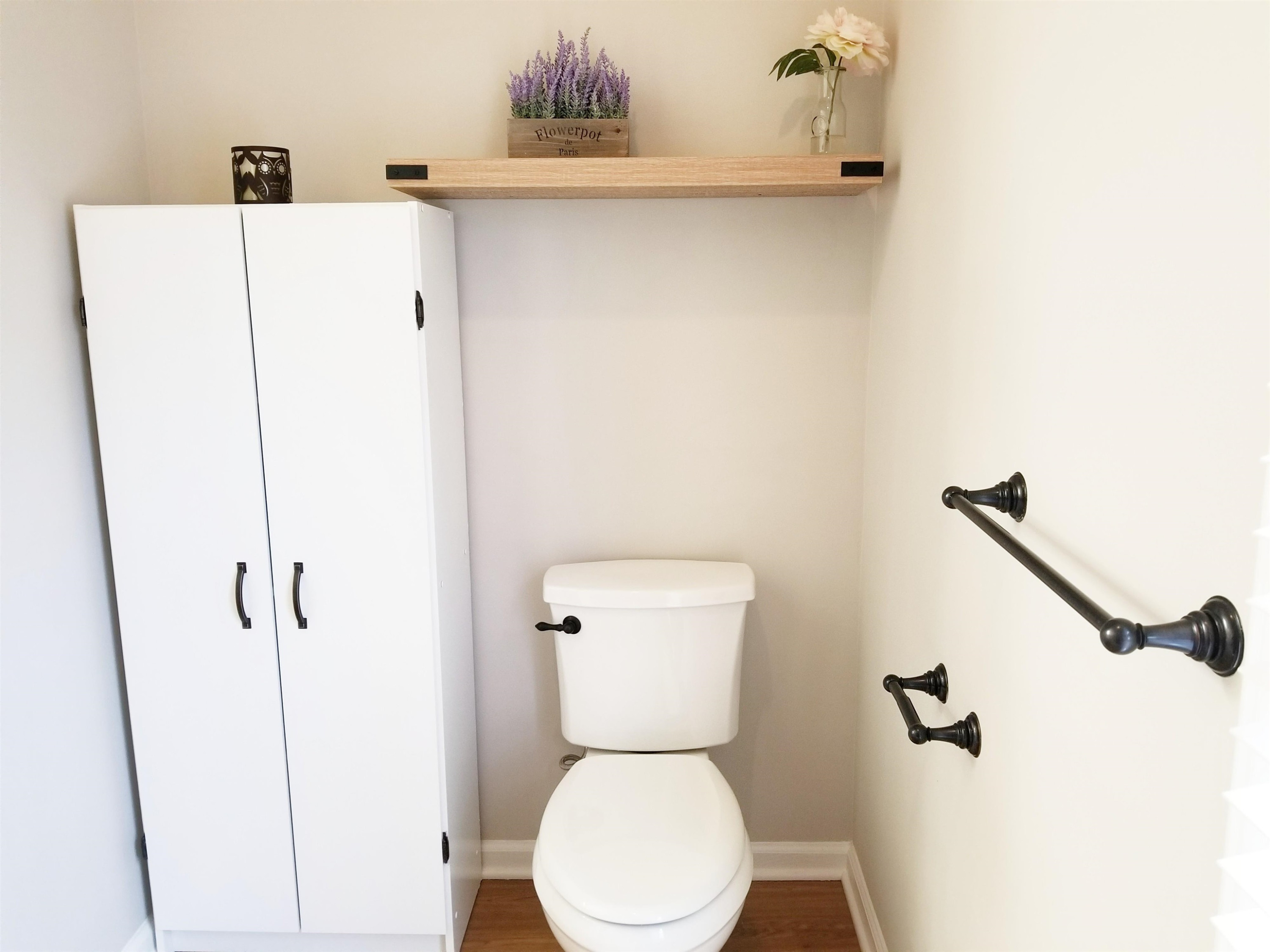 9305 Tallgrass Road Raleigh, NC 27603 - Photo 23 of 49 Linen closet stays for extra space! Shelving above newer commode! Owners Bathroom