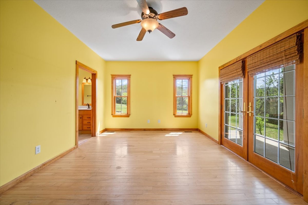 216 Old Wolf Hill Road Bethpage, TN 37022 - Photo 17 of 70 a view of an empty room with window and wooden floor
