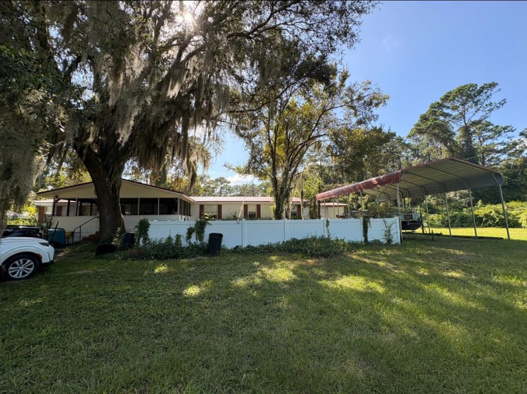 5249 Big Oak Road South St. Augustine, FL 32095 - Photo 1 of 20 a view of a house with a yard