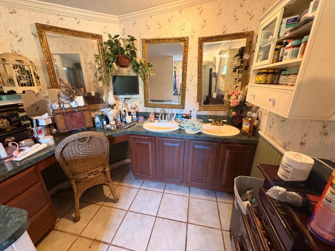 5249 Big Oak Road South St. Augustine, FL 32095 - Photo 19 of 20 a bathroom with a sink a mirror and a toilet