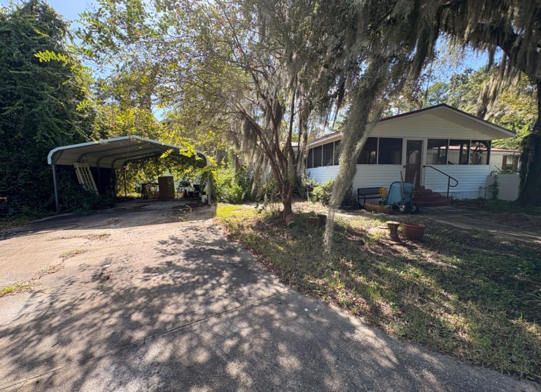 5249 Big Oak Road South St. Augustine, FL 32095 - Photo 2 of 20 a front view of a house with a yard