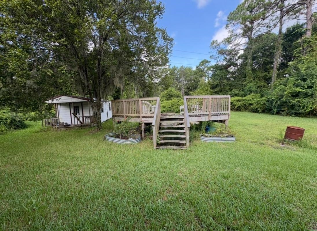 5249 Big Oak Road South St. Augustine, FL 32095 - Photo 6 of 20 a view of a house with backyard and sitting area