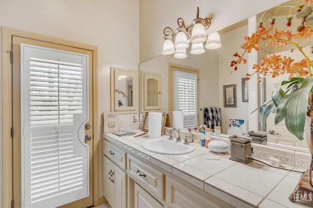 a kitchen with stainless steel appliances kitchen island granite countertop a sink and cabinets
