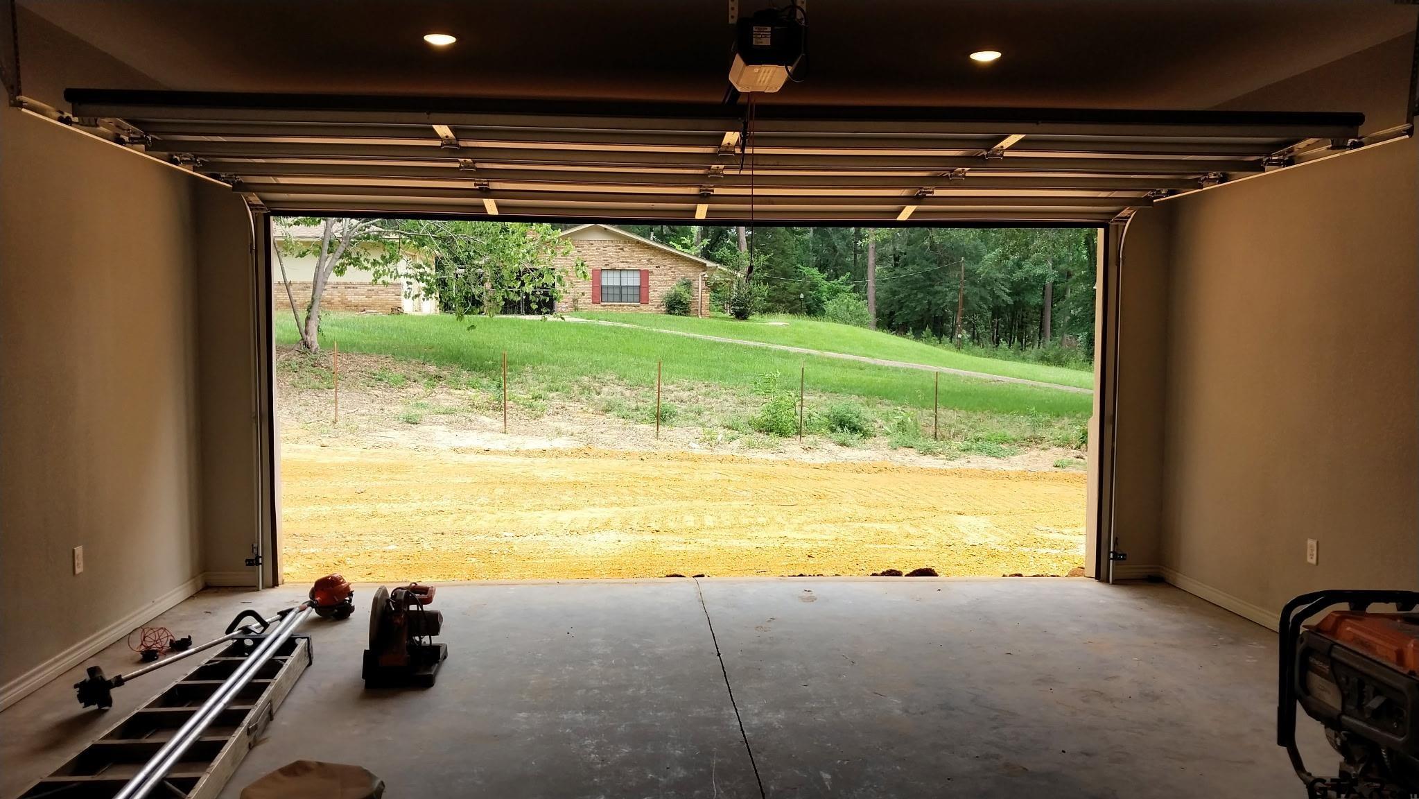 1262 George Richey Road Gladewater, TX 75647 - Photo 21 of 22 a view of a room with a large window and wooden floor
