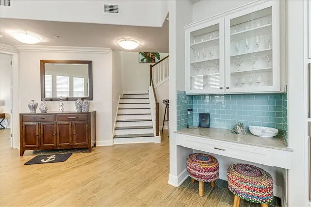 a view of an entryway with kitchen