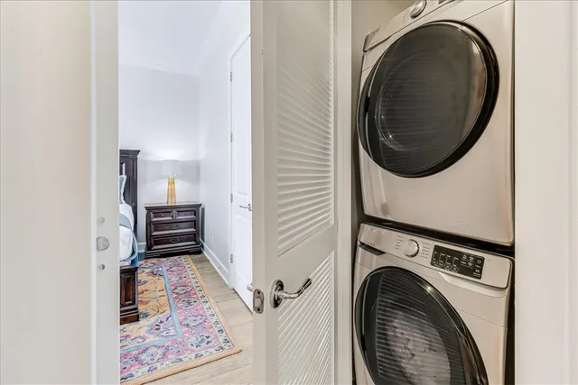 a view of a bedroom with washer and dryer