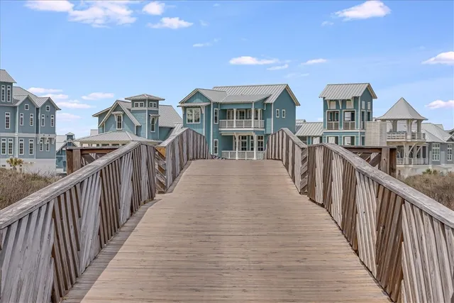 a view of a house with wooden deck
